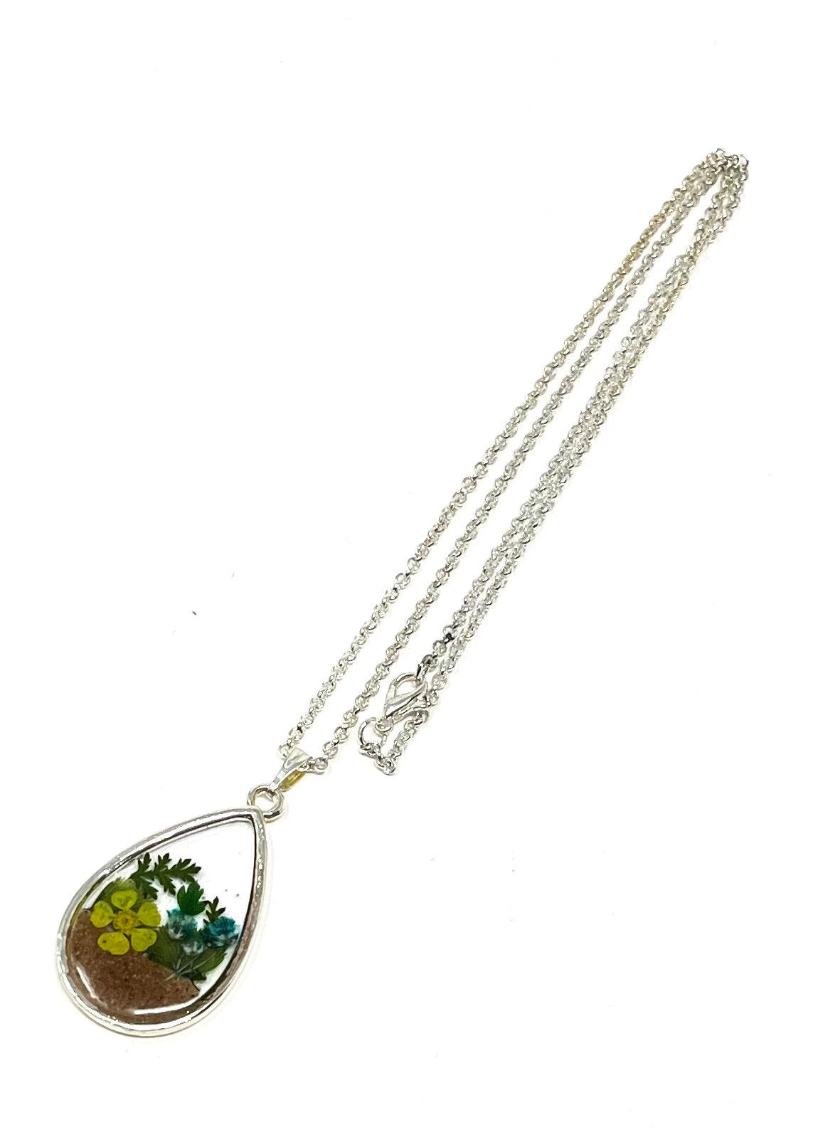 Teardrop Shaped Necklace featuring pressed wild flowers