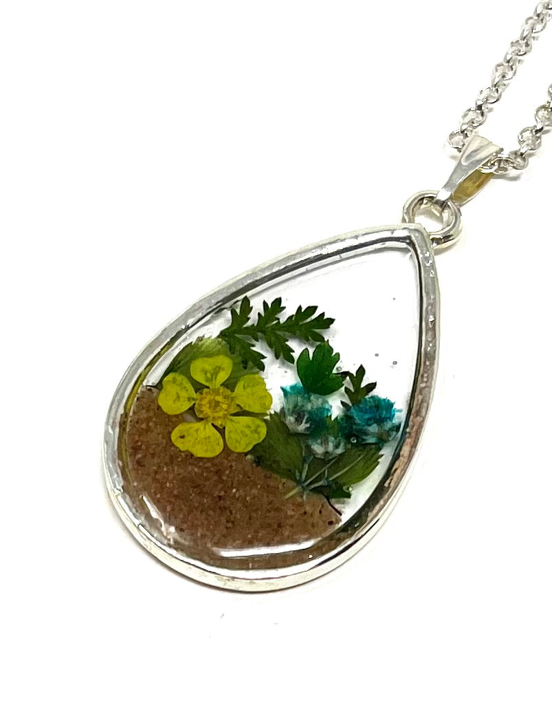 Teardrop Shaped Necklace featuring pressed wild flowers