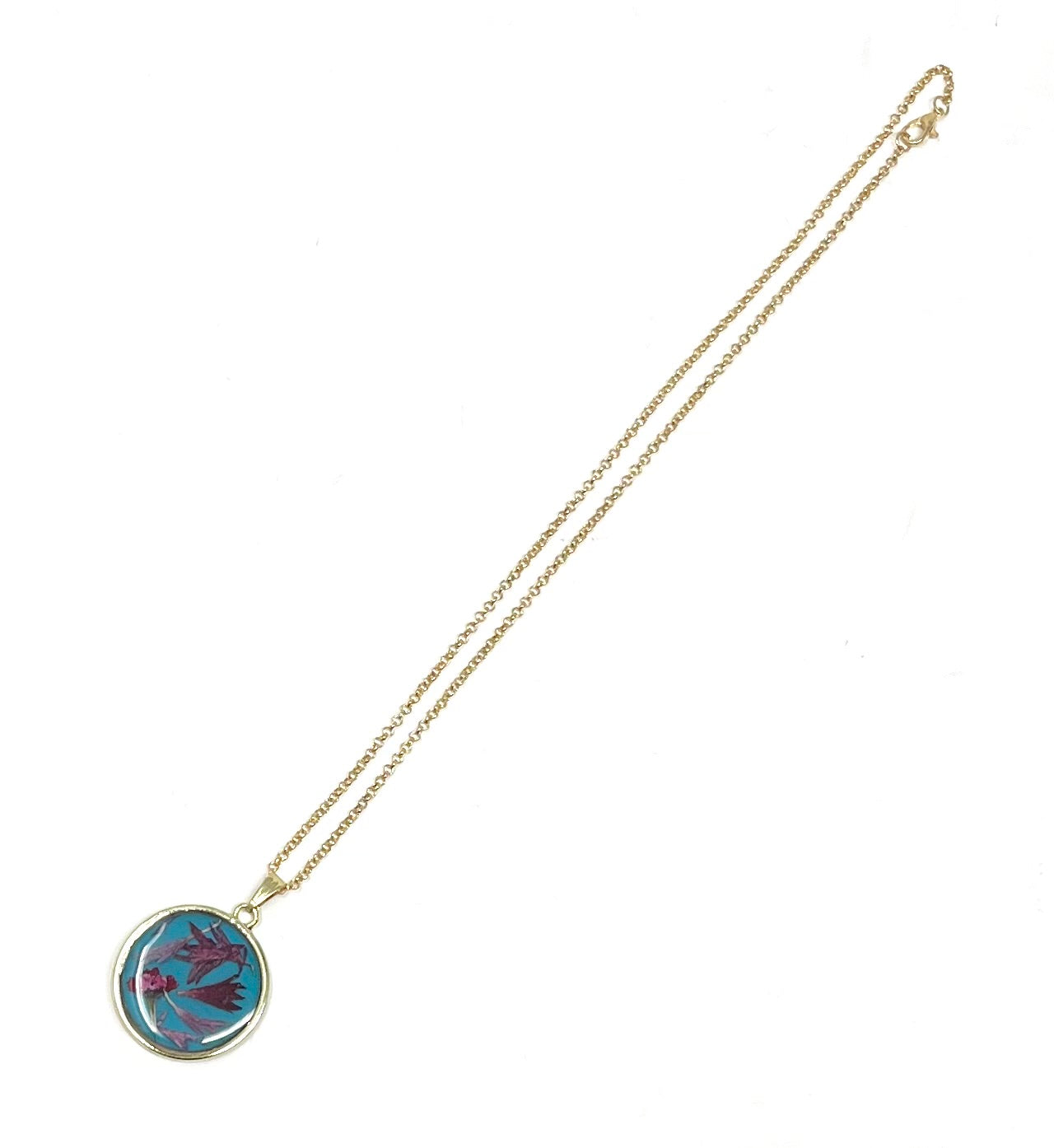 Round Necklace with Hand Pressed Wild Flowers on a Blue Base