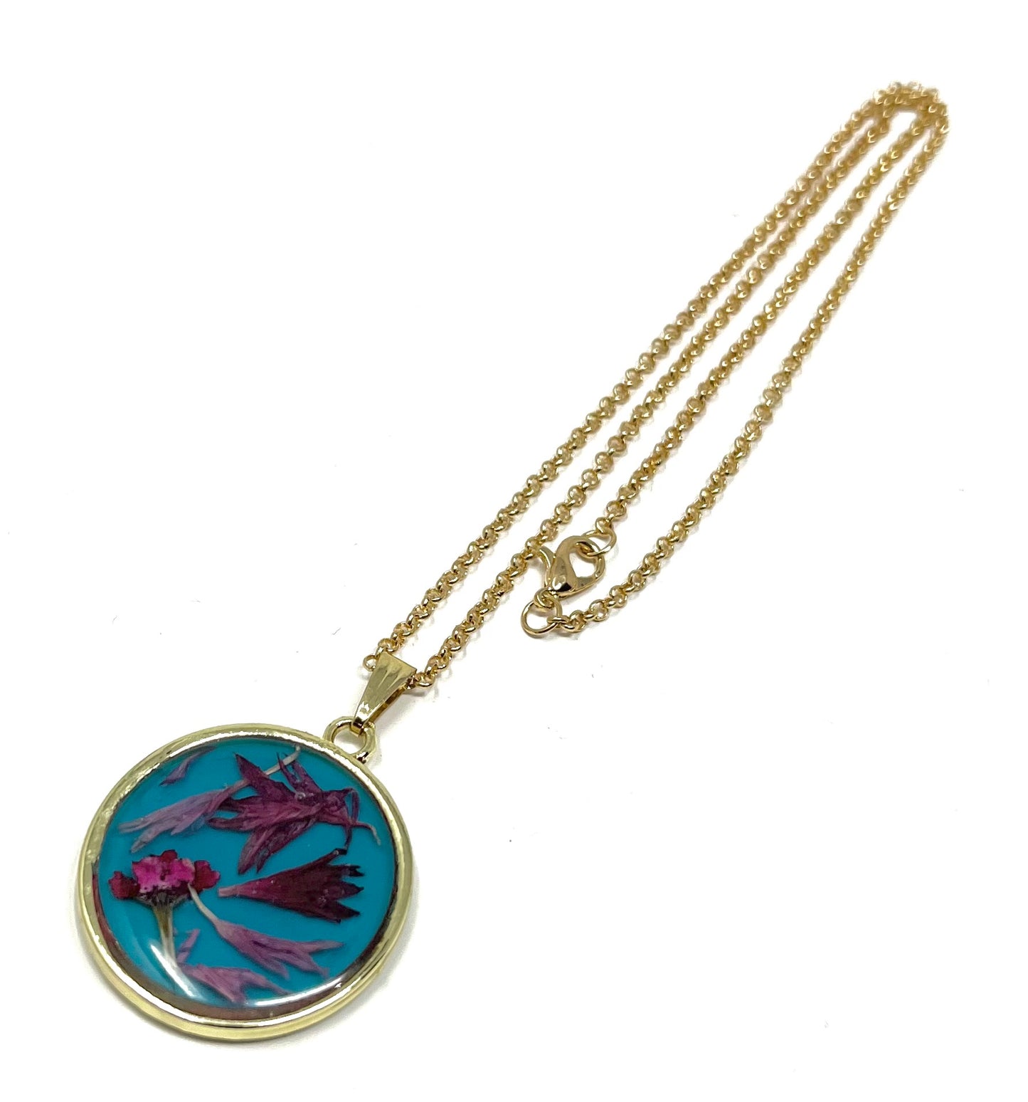 Round Necklace with Hand Pressed Wild Flowers on a Blue Base