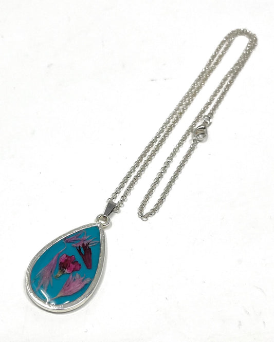 Teardrop Necklace with pressed Wild Flowers on a Blue Base